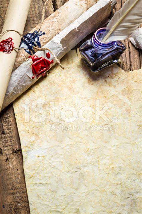 Inkwell And Ancient Scrolls On Old Sheet Of Paper Stock Photo Royalty