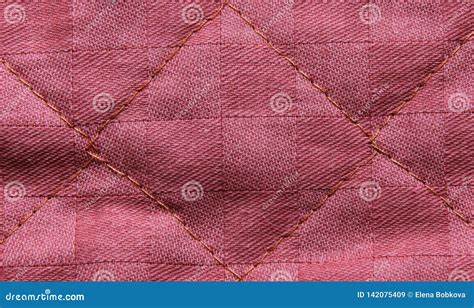 The Texture Of The Pale Pink Quilted Textile Backgrounds Close Up