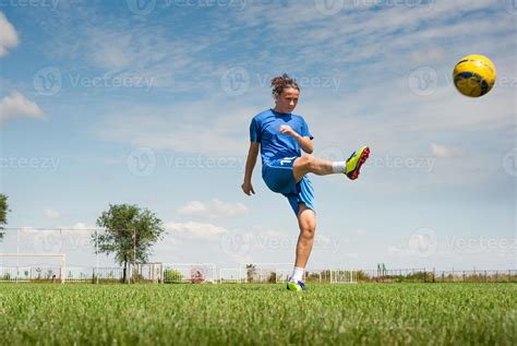 Girl Kicking Soccer Ball 897277 Stock Photo At Vecteezy