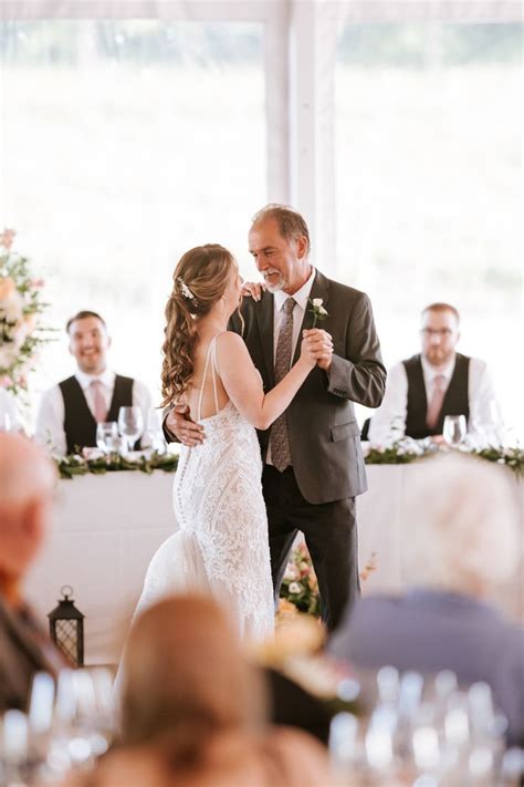 A Bride And Groom Sharing Their First Dance