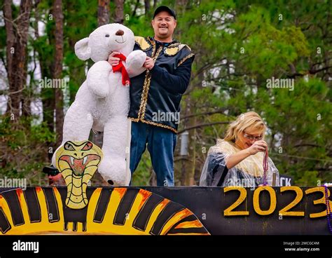 Members Of Krewe De La Dauphine Ride A Mardi Gras Float During The