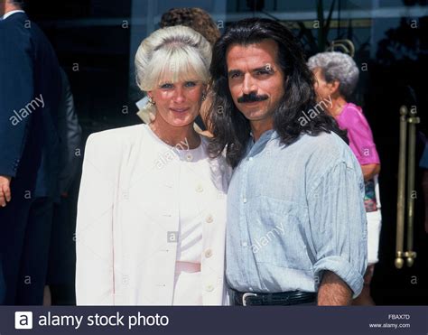 LINDA EVANS WITH HER BOYFRIEND YANNI CHRYSSOMALIS, GREECE - 1990 Stock ...