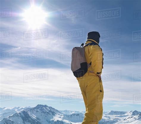 Man Standing On Mountain Top Stock Photo Dissolve