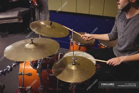 Male student playing drum set in a studio — caucasian, indoors - Stock ...