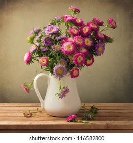 Beautiful Aster Flower Bouquet On Wooden Stock Photo 116582800 | Shutterstock