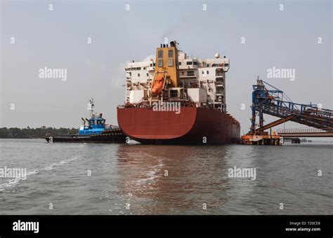 Port Operations For Managing And Transporting Iron Ore Tug Moving And