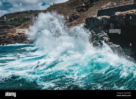 Big Wave Crushing On Rocky Coast Waves Hit Rocks On Shore Stock Photo