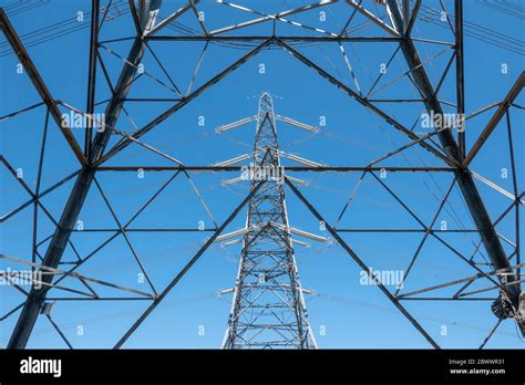 A High Voltage Electricity Pylon Seen Through A Close Up Of The Lattice