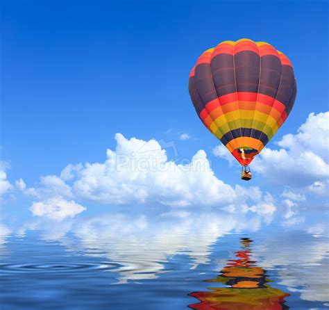 Colorful Hot Air Balloons Flight Blue Sky With Water Reflection By