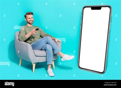 Full Body Photo Of Millenial Guy Watch Tv Wear Shirt Jeans Sneakers