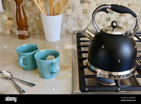Preparing A Hot Cup Of Tea In The Kitchen Stock Photo Alamy
