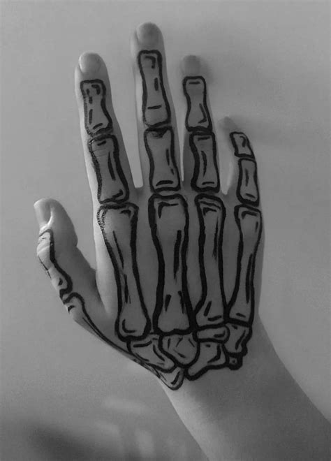 A Person S Hand Painted With Black And White Ink Showing The Skeleton