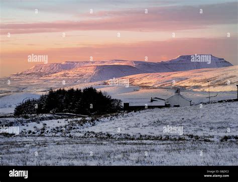 A Farmhouse Stands Surrounded By Snow In The Three Peaks Area Of The