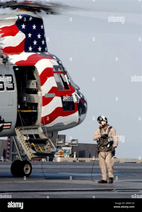 US Navy A Pilot Of A CH 46 Sea Knight Helicopter Conducts A Pre