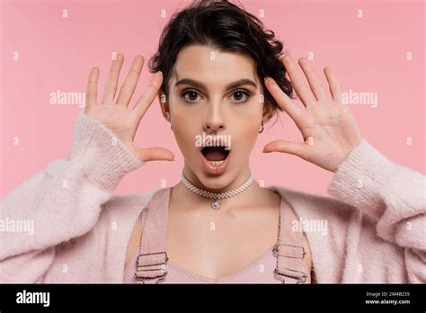 Shocked Brunette Woman With Open Mouth Looking At Camera Isolated On