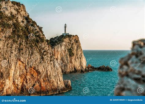 Beautiful Lighthouse Surrounded By Steep Cliffs At The Most Southen