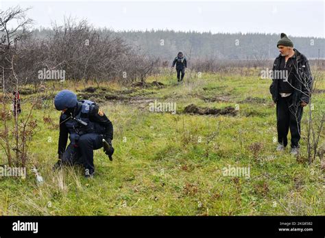 A Ukrainian Sapper L Inspects The Ground During The Demining