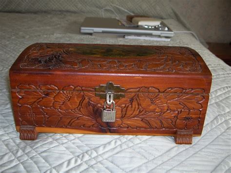 Small Antique Cedar Chest With Designs Cut Into The Top And