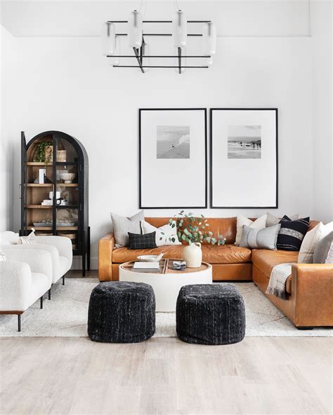 A Living Room With Two Couches Chairs And A Coffee Table In The Center