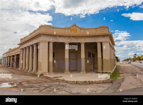 An Old Bank Building Built In The Classical Style Sits Abandoned On A