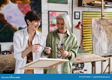 Two Mature Women Standing Together In Stock Image Image Of Lgbtq