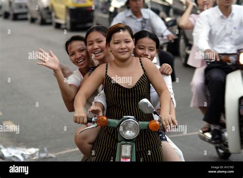 Four Young Vietnamese Girls On A Motorbike In Saigon Hcmc Vietnam