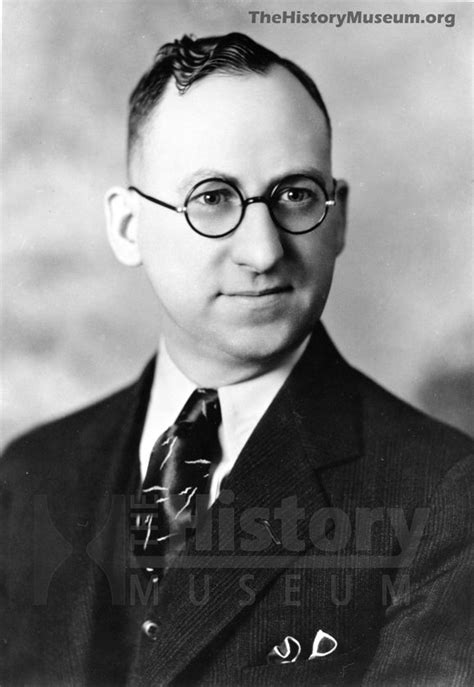 An Old Black And White Photo Of A Man With Glasses Wearing A Suit And Tie