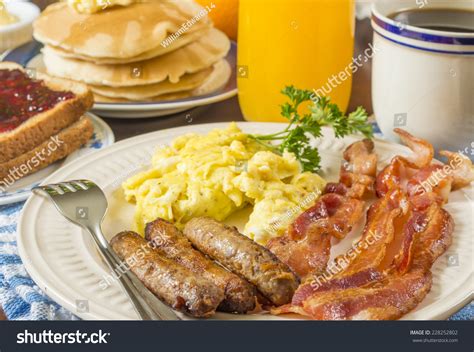 Scrambled Eggs And Bacon And Pancakes