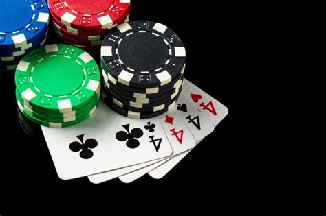 Premium Photo | Poker game with four of kind combination Chips and