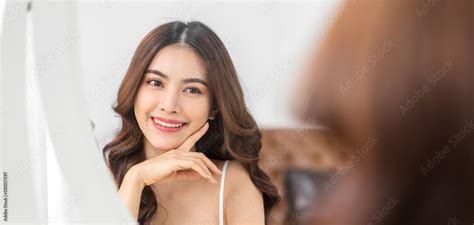 Smiling Of Young Beautiful Pretty Asian Woman Clean Fresh Healthy White Skin Looking At Mirror