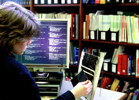 Using Microfiche In Library Photograph By Peter Aprahamian Science