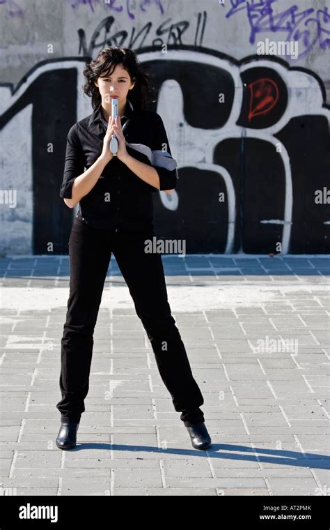 Mafia girl in urban graffiti background Stock Photo - Alamy