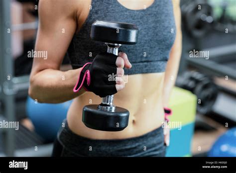 Woman Lifting Dumbbell Stock Photo Alamy