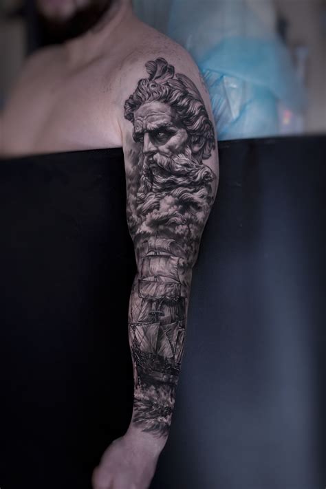 A Man With A Tattoo On His Arm