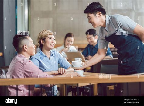 Couple Being Served Coffee Hi Res Stock Photography And Images Alamy