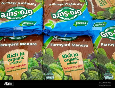 A Stack Of Bags Of Farmyard Manure Improving Soil Quality And Promoting