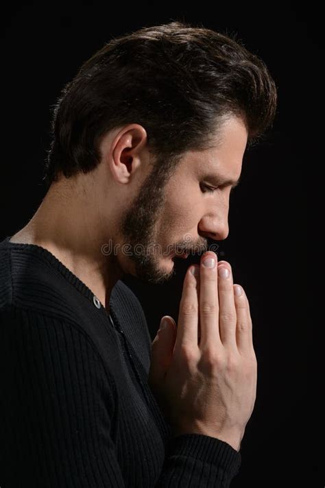 The Power Of Prayer Side View Of Bearded Man Praying And Holding His