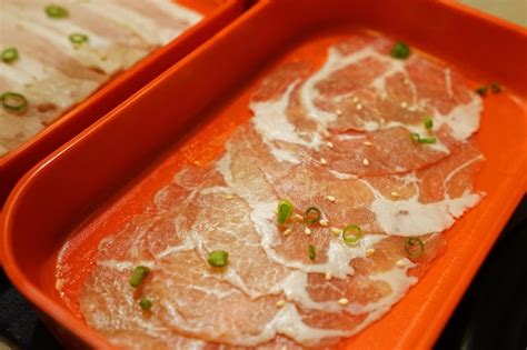 Premium Photo Close Up Raw Beef And Pork Slices Prepared For Shabu Shabu Japanese Hot Pot