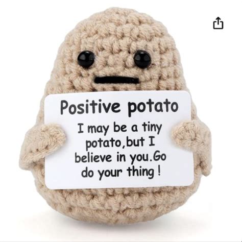 A Stuffed Toy With A Sign That Says Positive Potato I May Be Tiny