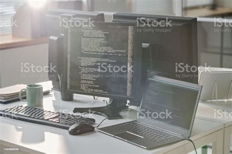 Workplace Of Computers With Codes On Screen Stock Photo Download