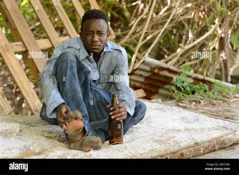 Young Homeless African Man Drinking Beer In The Streets Stock Photo Alamy