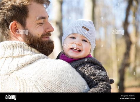 Happy Father Carrying Daughter In Park Stock Photo Alamy