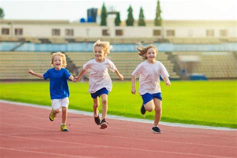 Child Running In Stadium Kids Run Healthy Sport Stock Photo Image