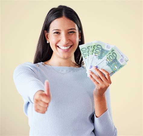 Premium Photo Thumbs Up Money And Finance Growth With Cash Bank Notes