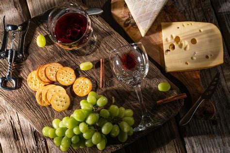 Different Types Of Cheeses Cheese Tasting With Grapes And Crackers And