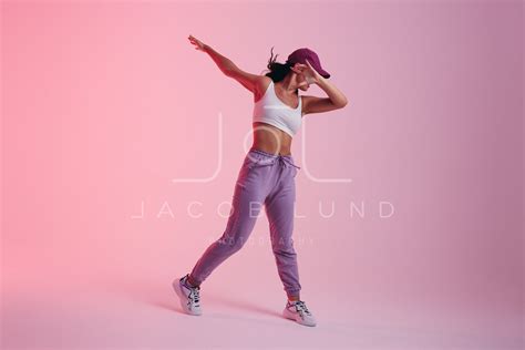 Young Woman Doing The Dab Dance Move In A Studio Jacob Lund