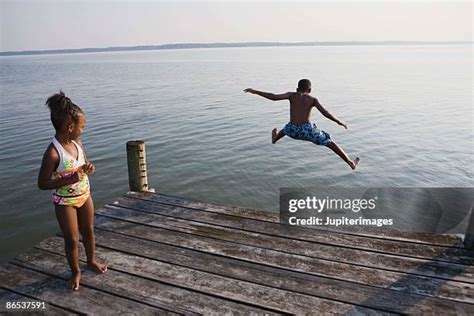 Kids Jumping Off Dock Photos And Premium High Res Pictures Getty Images