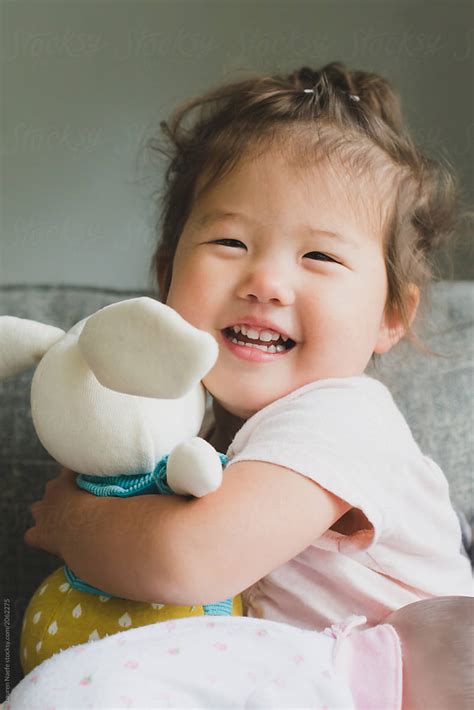 Baby Holding Stuffed Animal By Stocksy Contributor Lauren Lee Stocksy