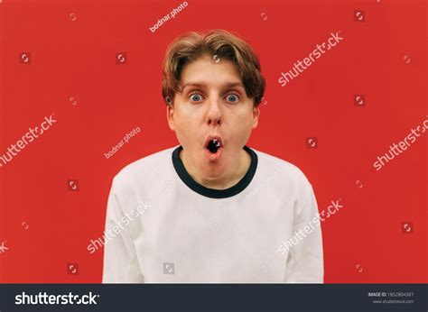 Close Portrait Shocked Guy White Clothes Stock Photo 1852804387