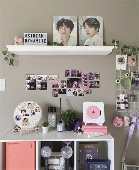 A White Shelf Topped With Pictures And Other Items